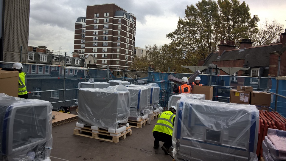 Expo World Logistics – Life science team installing 10 Qiagen Symphony systems and cabinets into the TDL Halo building, London